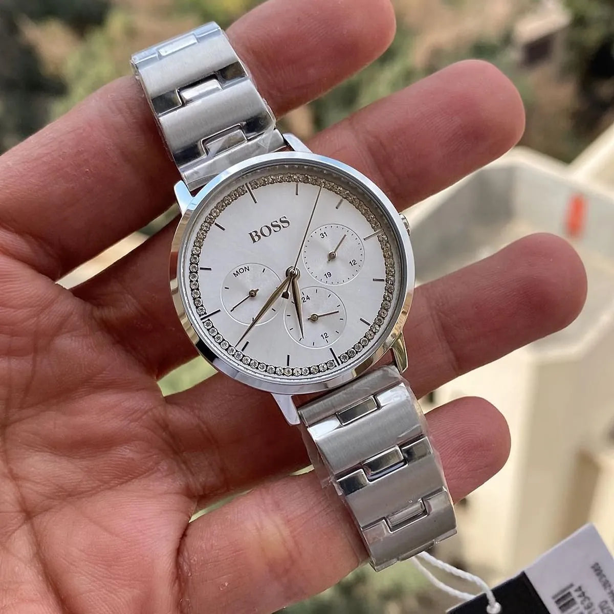 Hugo Boss Prima chronograph watch worn on wrist showing silver dial and metal bracelet