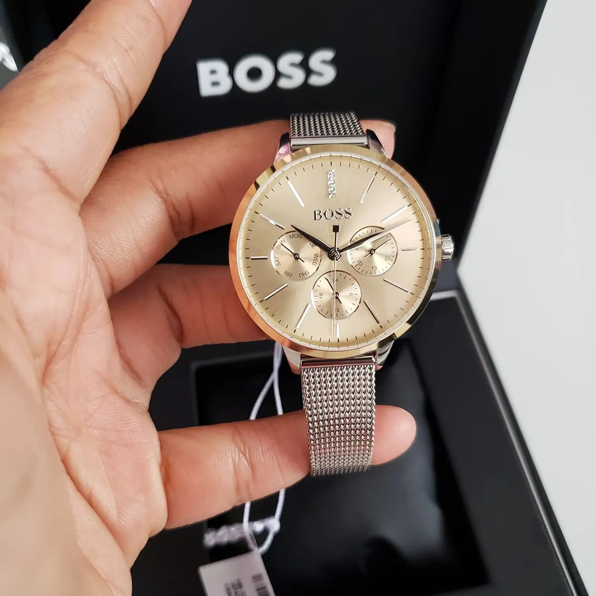 Hugo Boss Symphony women's watch in hand showing gold dial with three subdials
