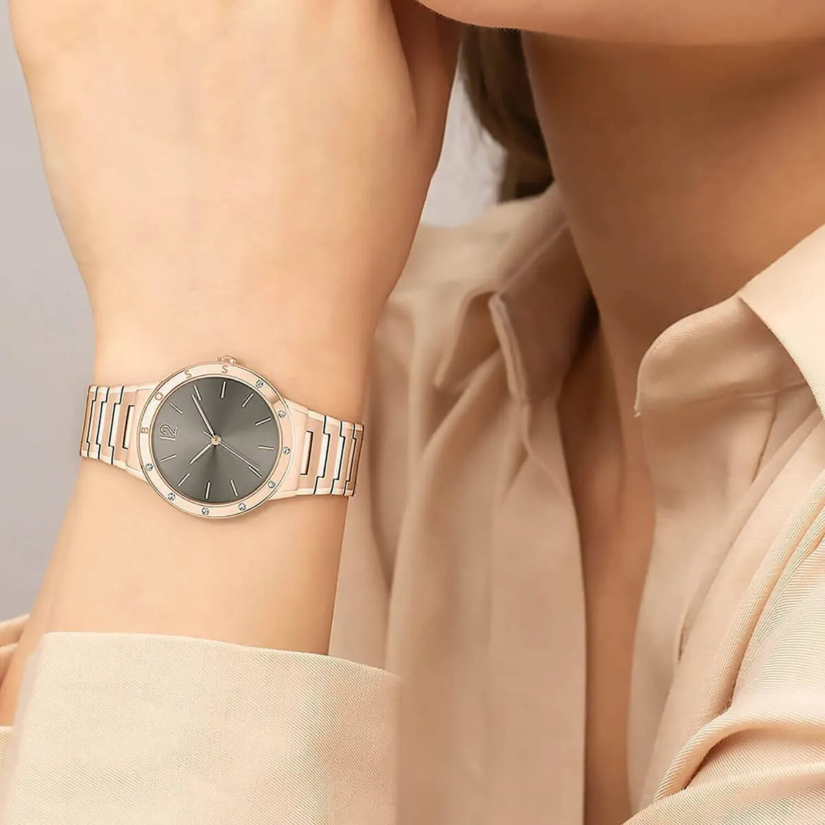 Hugo Boss Breath rose gold watch on wrist with neutral beige outfit styling
