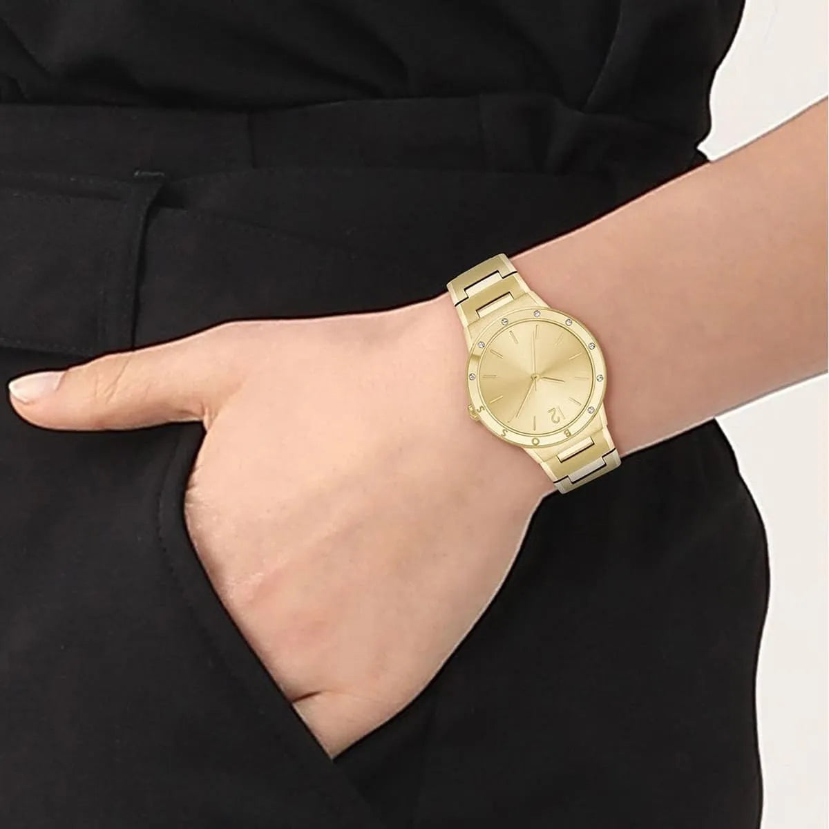 Hugo Boss PURE women's watch on wrist showing gold dial and matching bracelet
