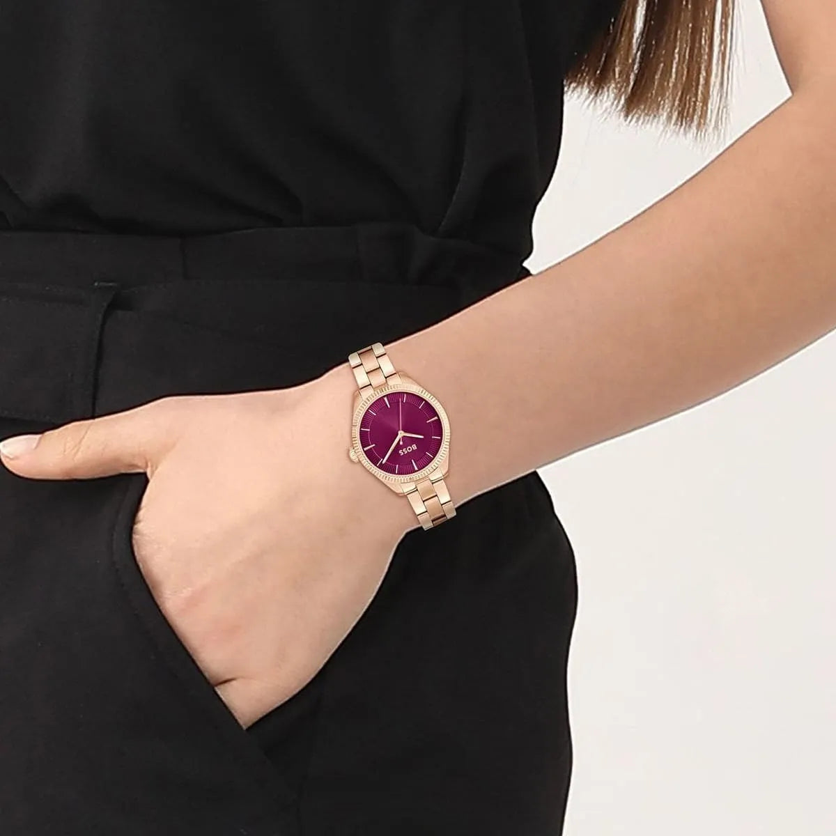 Hugo Boss Sage watch worn on wrist with purple dial against black outfit