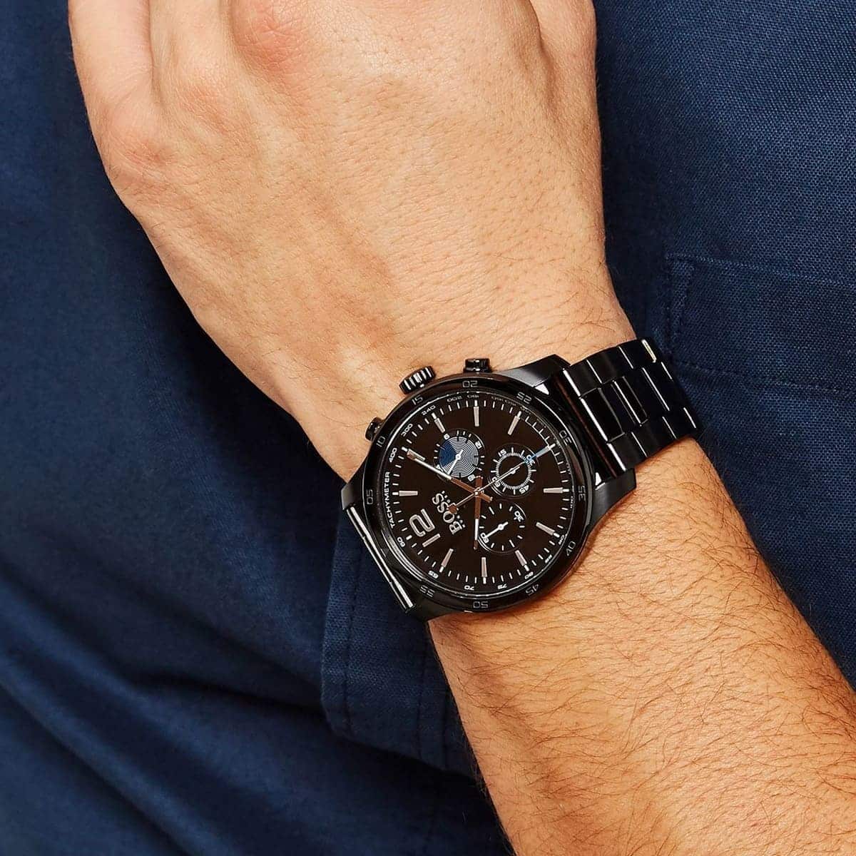 Hugo Boss 1513528 chronograph watch on men's wrist showing black dial and metal bracelet