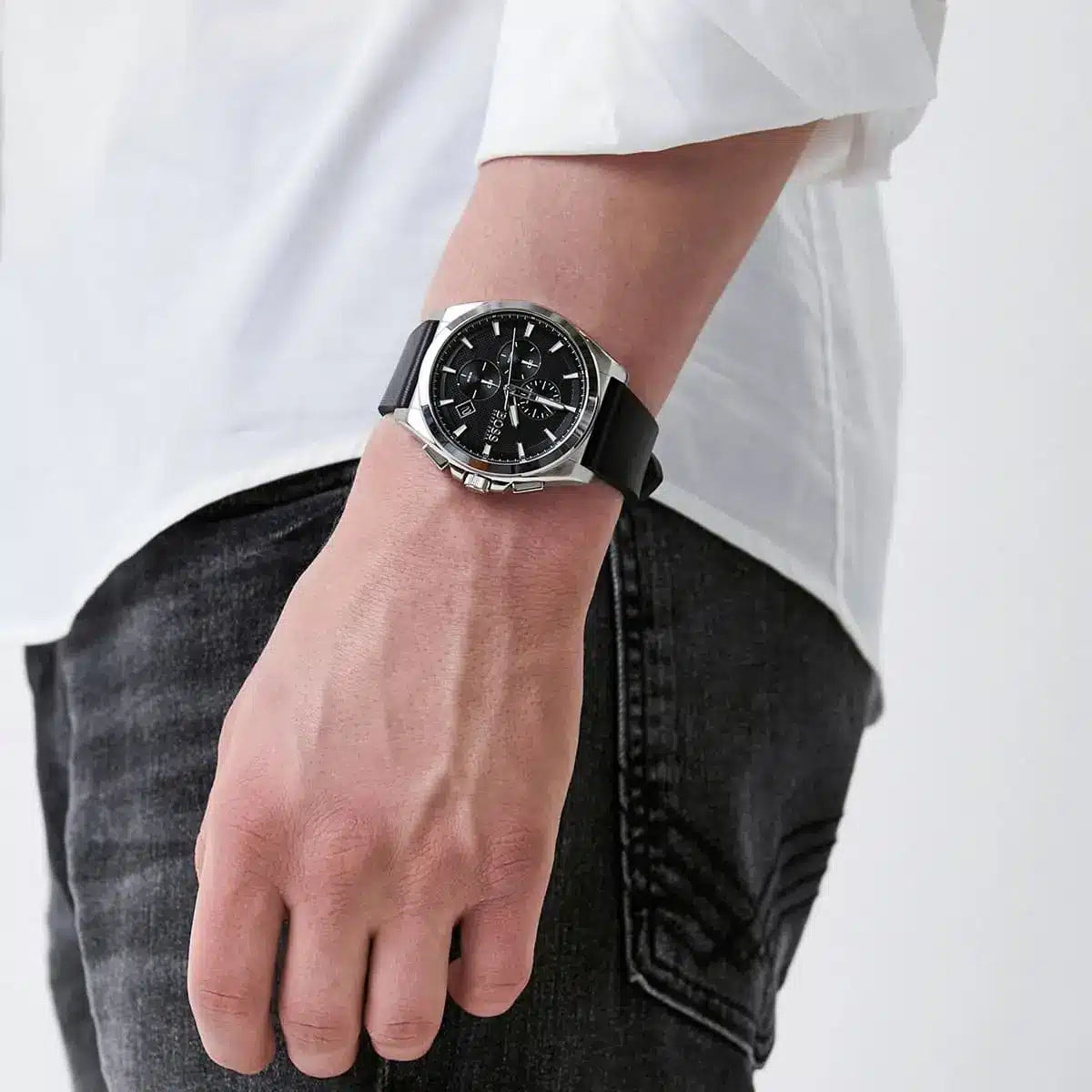Hugo Boss Grandmaster chronograph watch worn on wrist with white shirt