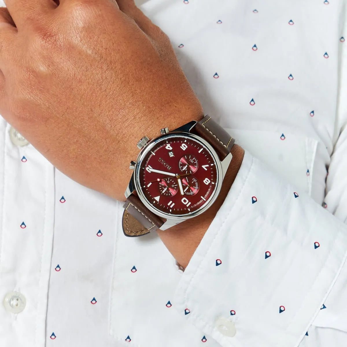 Hugo Boss 1513988 chronograph watch worn on wrist showing burgundy dial and brown leather strap