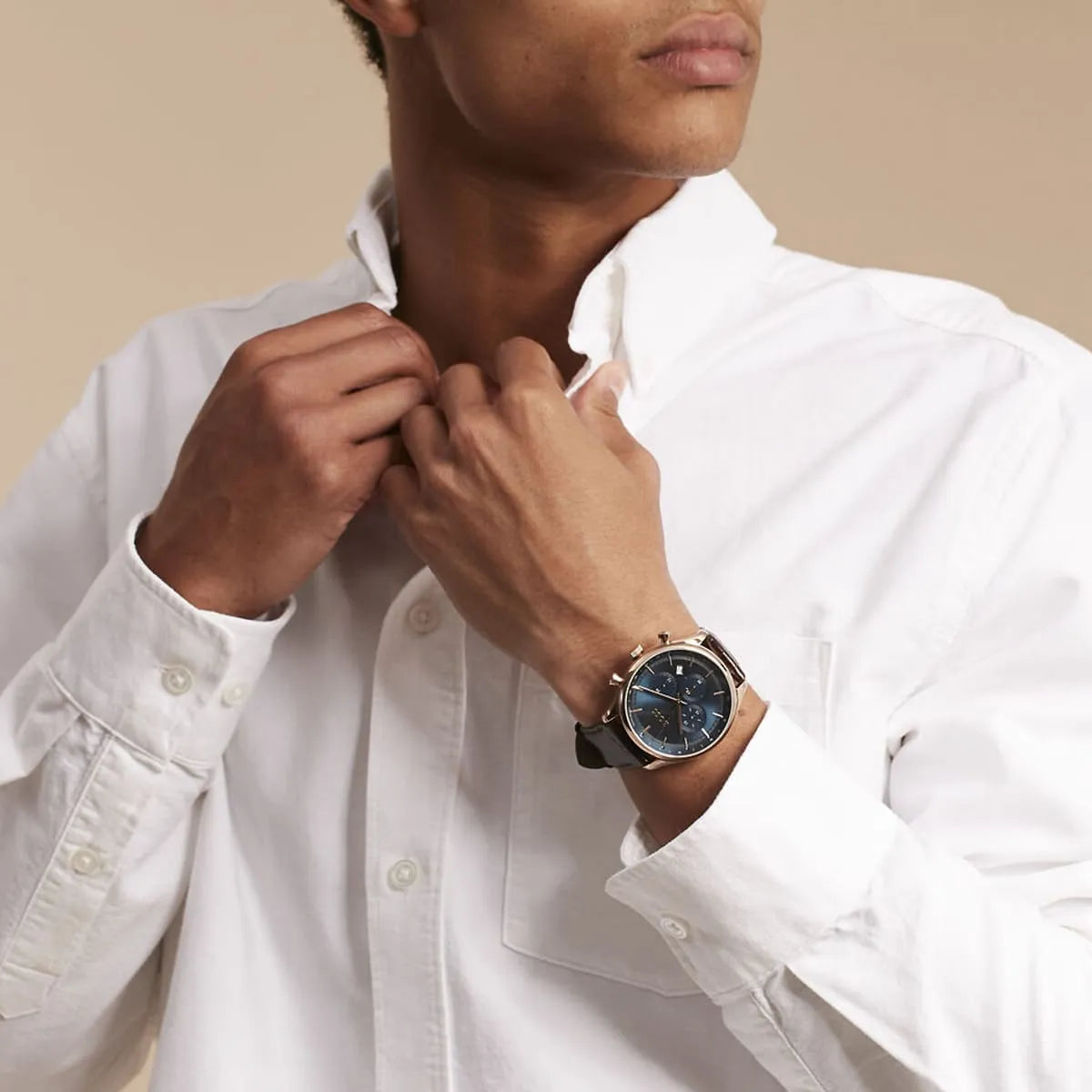 Man wearing white shirt and Hugo Boss Gregor chronograph watch on wrist