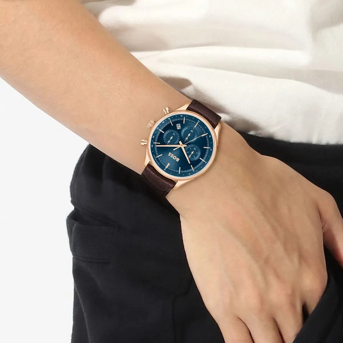 Hugo Boss Gregor chronograph watch on wrist displaying blue dial and leather strap detail