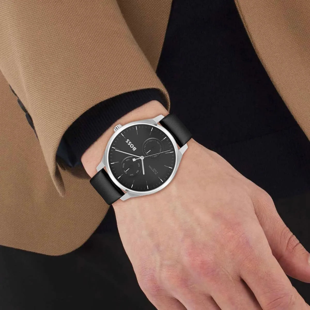 HUGO BOSS chronograph men's watch worn on wrist with black leather strap and black dial