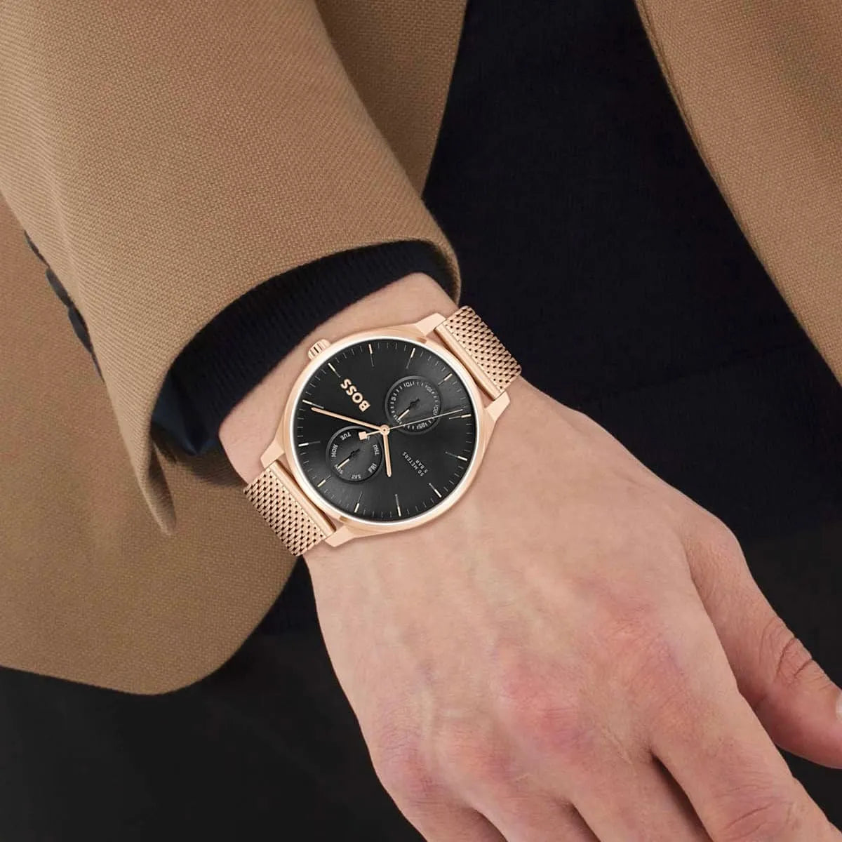 Hugo Boss Tyler black dial rose gold watch worn on wrist