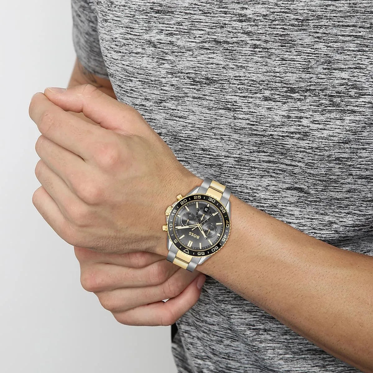 Hugo Boss Runner Chronograph worn on wrist with gray two-tone metal band