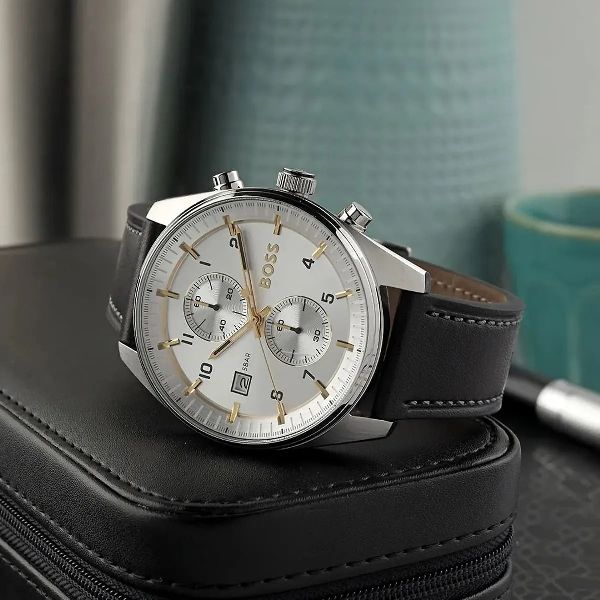 Hugo Boss Skymaster chronograph watch positioned on black leather case with lifestyle styling