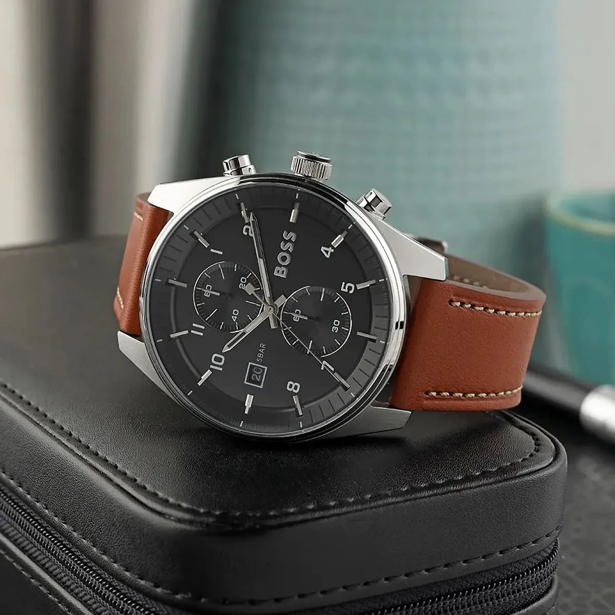 Hugo Boss Skytraveller watch side view showing chronograph pushers and brown leather strap