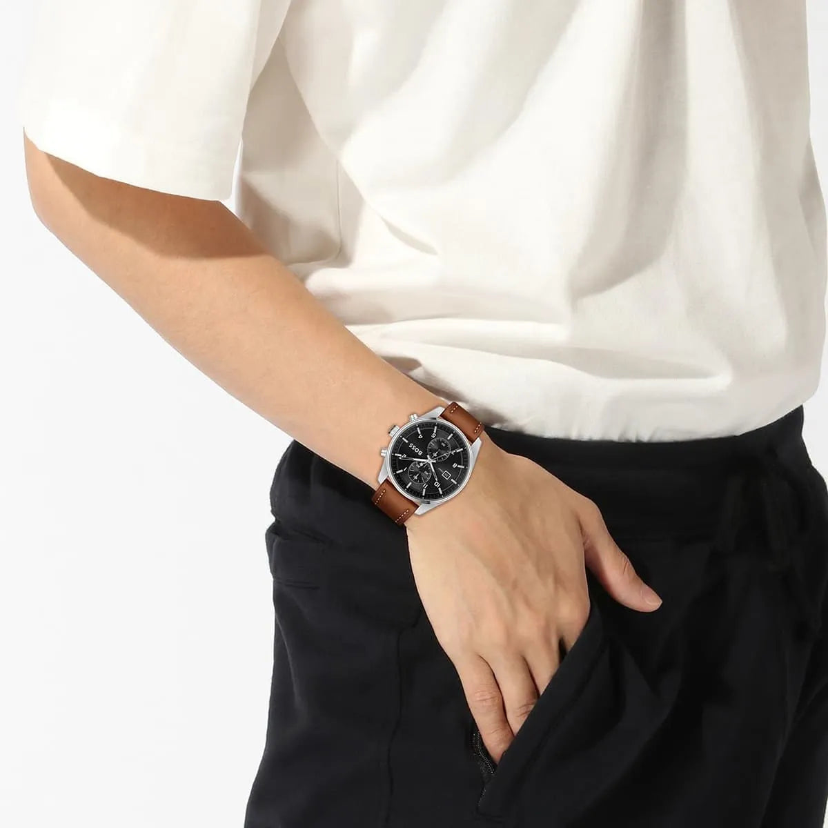 Hugo Boss Skytraveller chronograph watch worn on wrist with brown leather strap