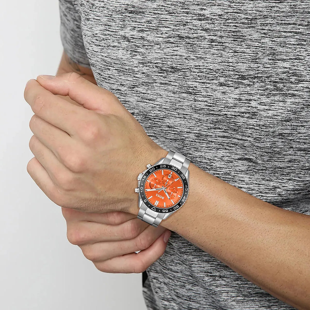 Hugo Boss Runner chronograph watch worn on wrist with orange dial visible