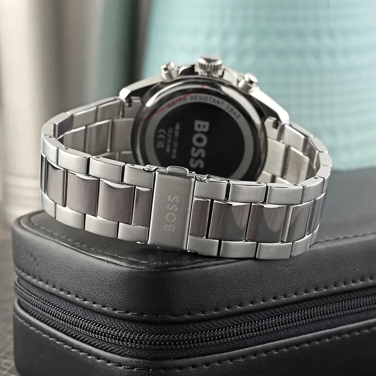Hugo Boss Runner watch side view showing metal bracelet and black bezel