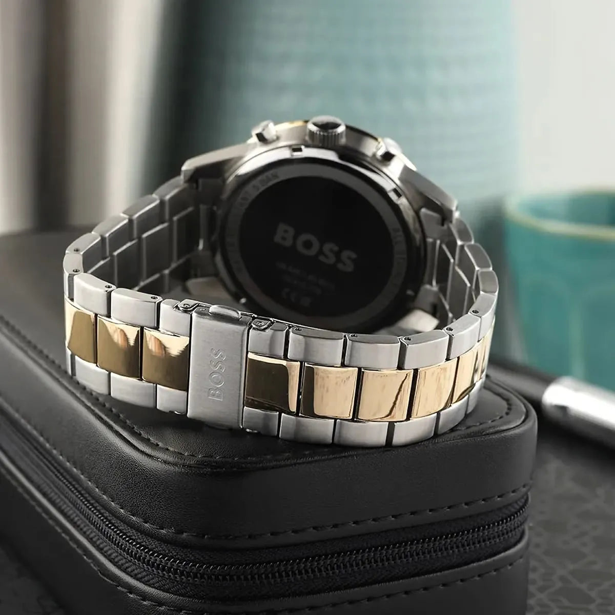 Hugo Boss Allure chronograph watch caseback view on black leather case showing stainless steel back