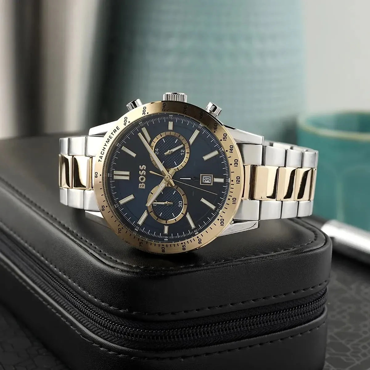 Hugo Boss Allure chronograph men's watch on black leather case with blue dial and gold-silver bracelet