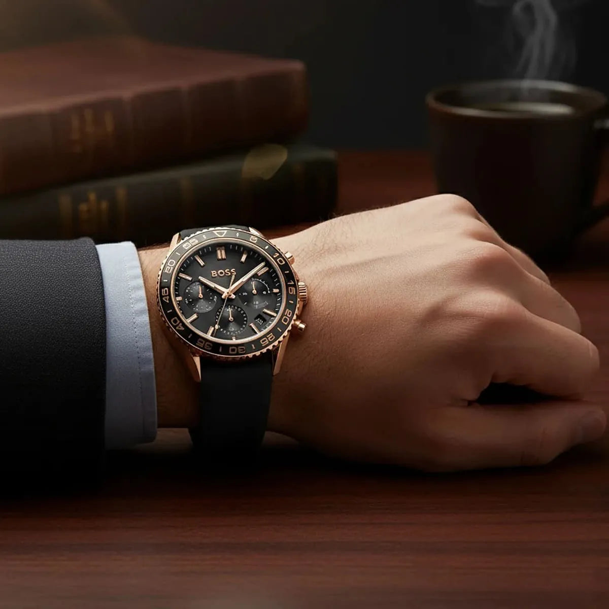 Hugo Boss Runner chronograph watch worn on wrist with rose gold case and black strap