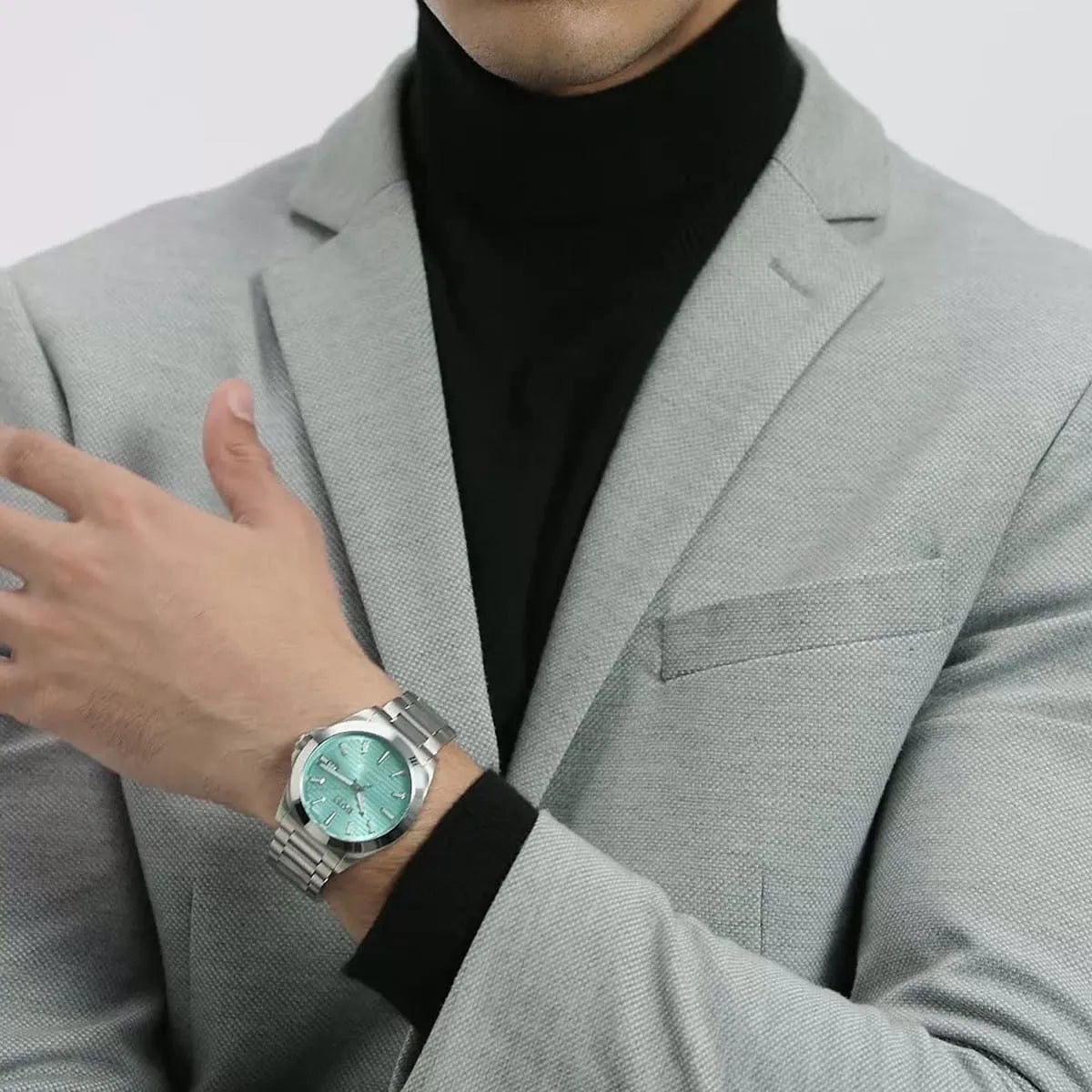 Hugo Boss Strike watch worn on wrist with turquoise dial visible
