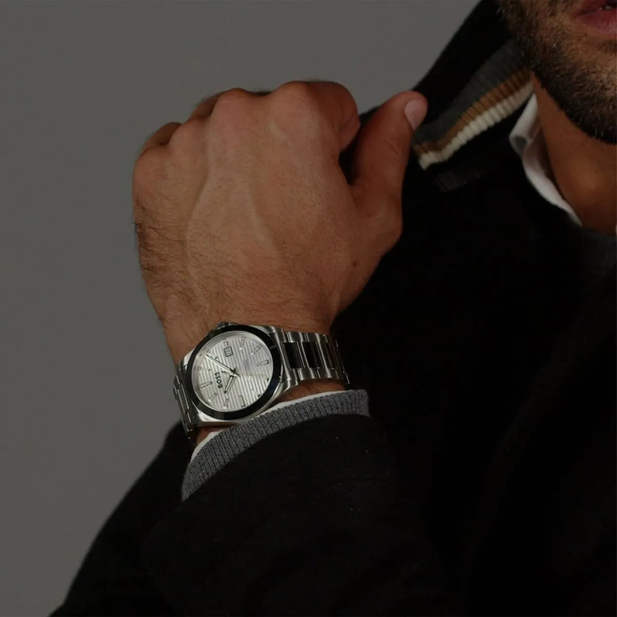 Hugo Boss Skymaster men's watch worn on wrist with black jacket and grey shirt
