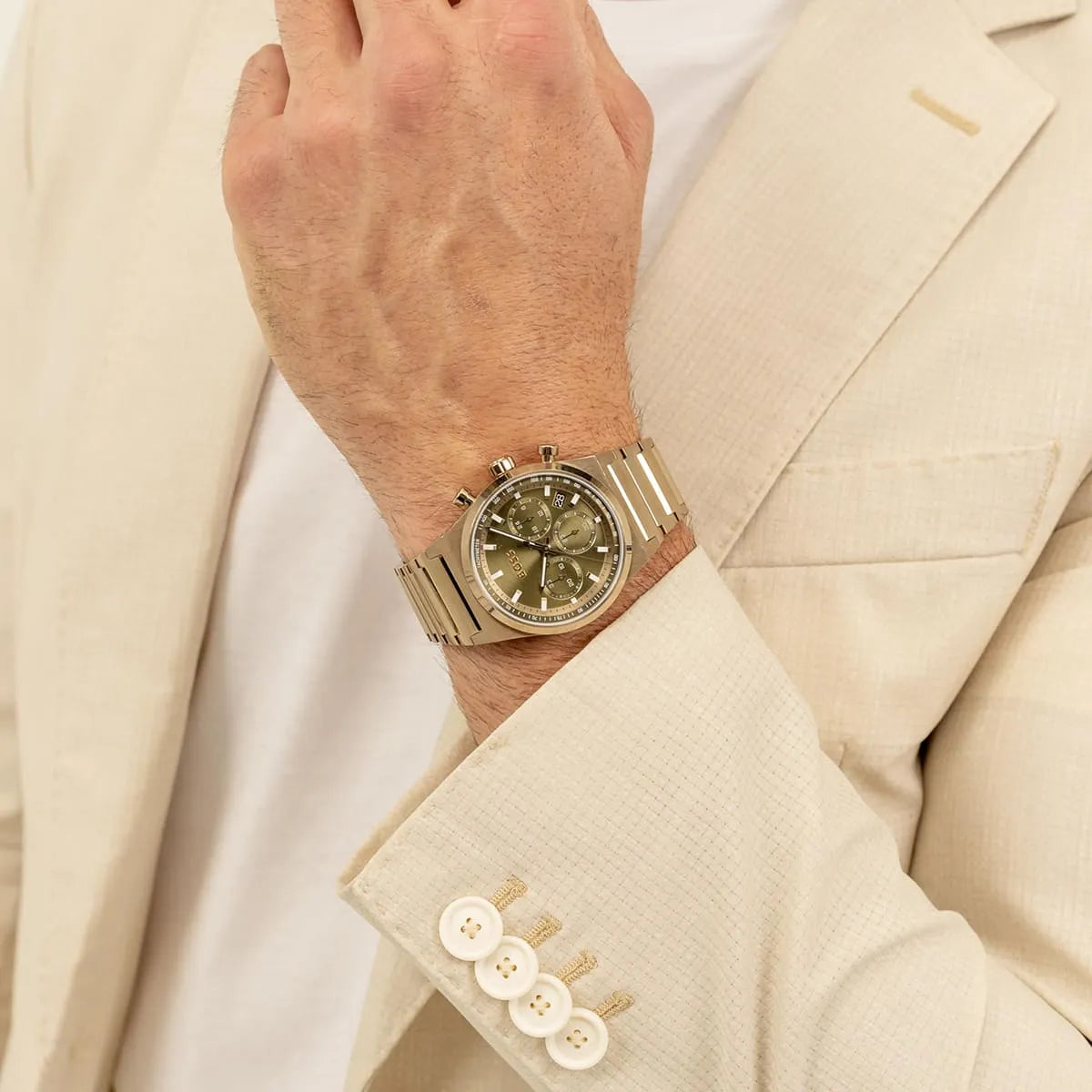 Hugo Boss Candor chronograph watch worn on wrist with green dial