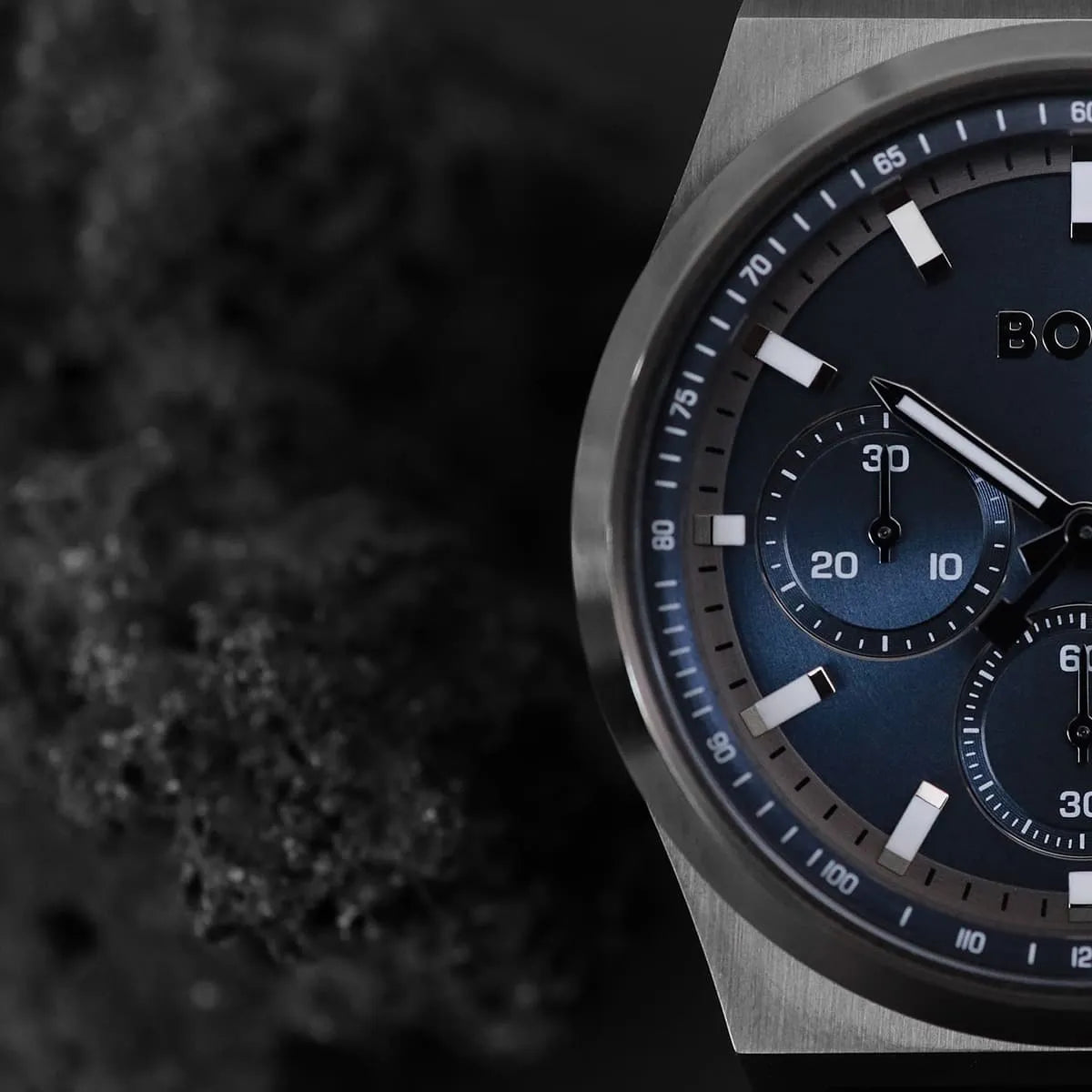 Close-up of Hugo Boss Candor Chrono blue dial with chronograph subdials and tachymeter scale