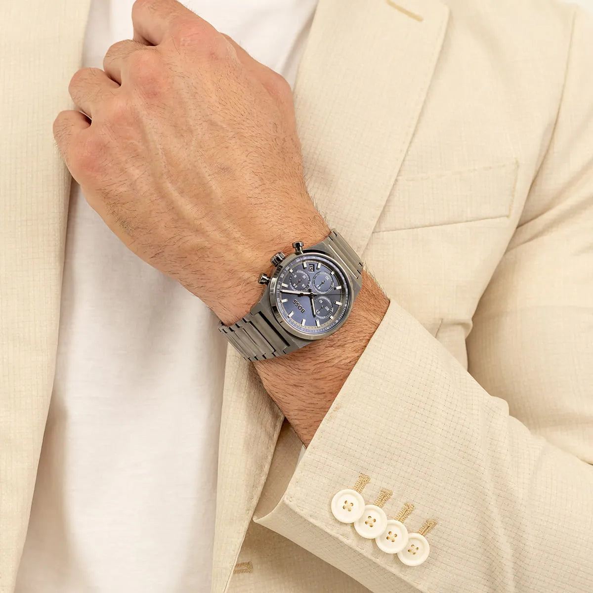 Hugo Boss Candor Chrono watch worn on wrist with formal cream blazer and white shirt