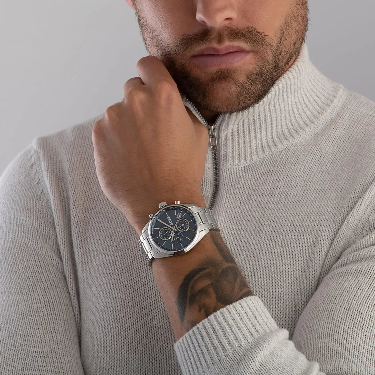Man wearing Hugo Boss Grand Prix watch on wrist with casual sweater styling