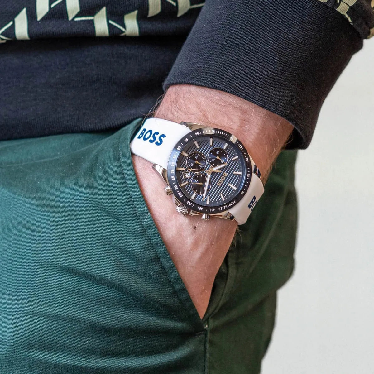 Hugo BOSS STRIKE watch worn on wrist showing blue dial and white strap with BOSS logo