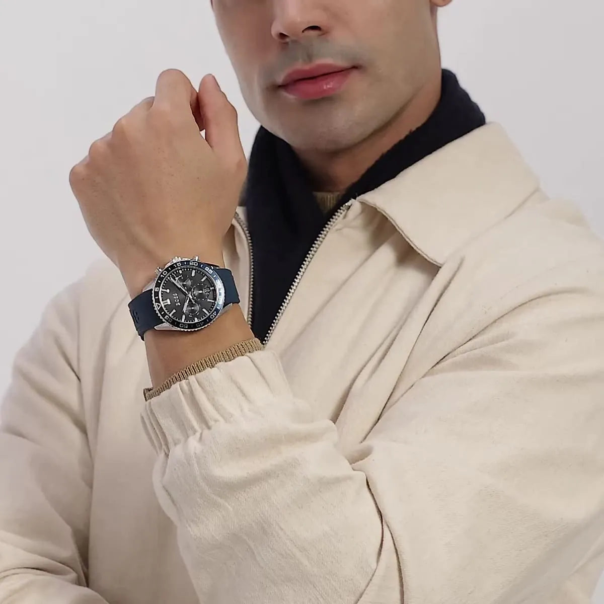 BOSS chronograph watch worn on male wrist showing black dial and blue strap