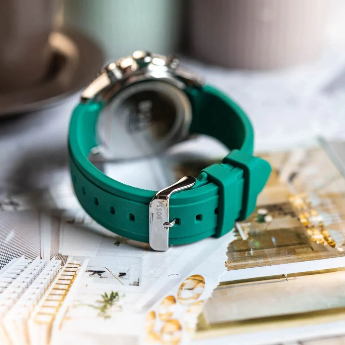 Hugo Boss PIONEER chronograph watch on wrist detail showing caseback and green strap