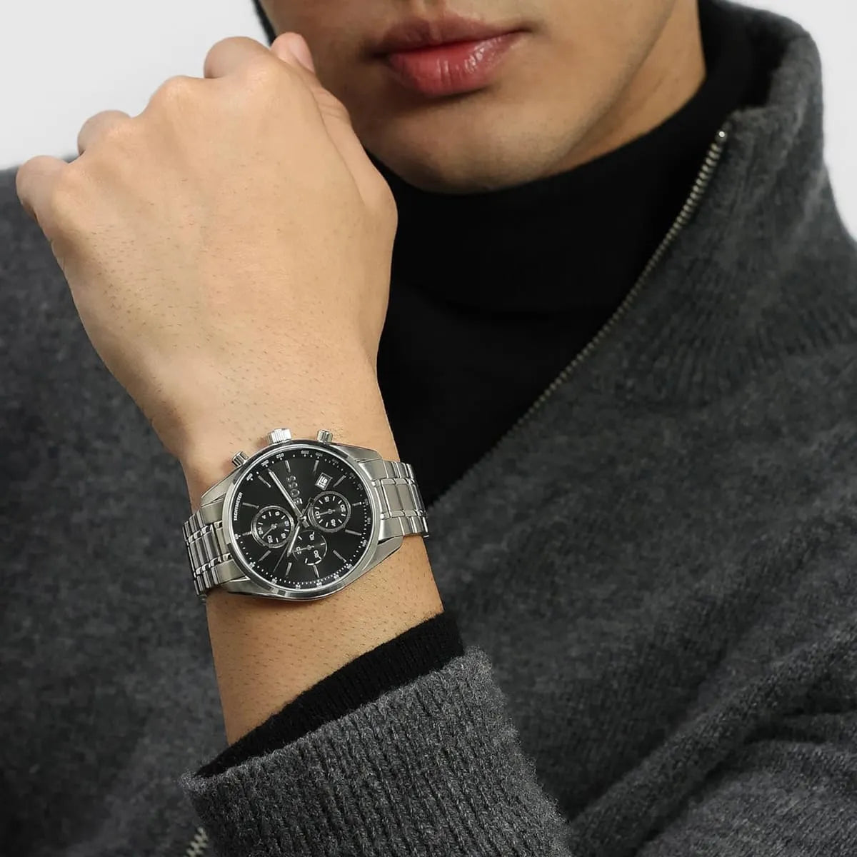 Hugo Boss Grand Prix chronograph watch worn on wrist showing black dial and steel bracelet