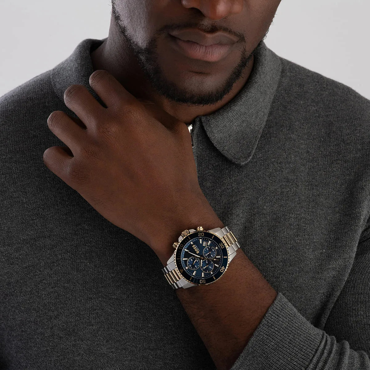 Hugo Boss Admiral chronograph watch worn on wrist, showing blue dial and two-tone bracelet