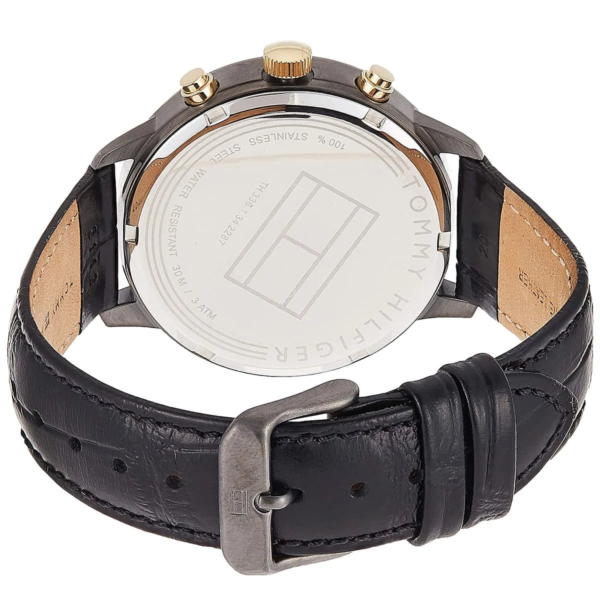 Back of Tommy Hilfiger Liam watch showing stainless steel case back and black leather strap with tan leather lining