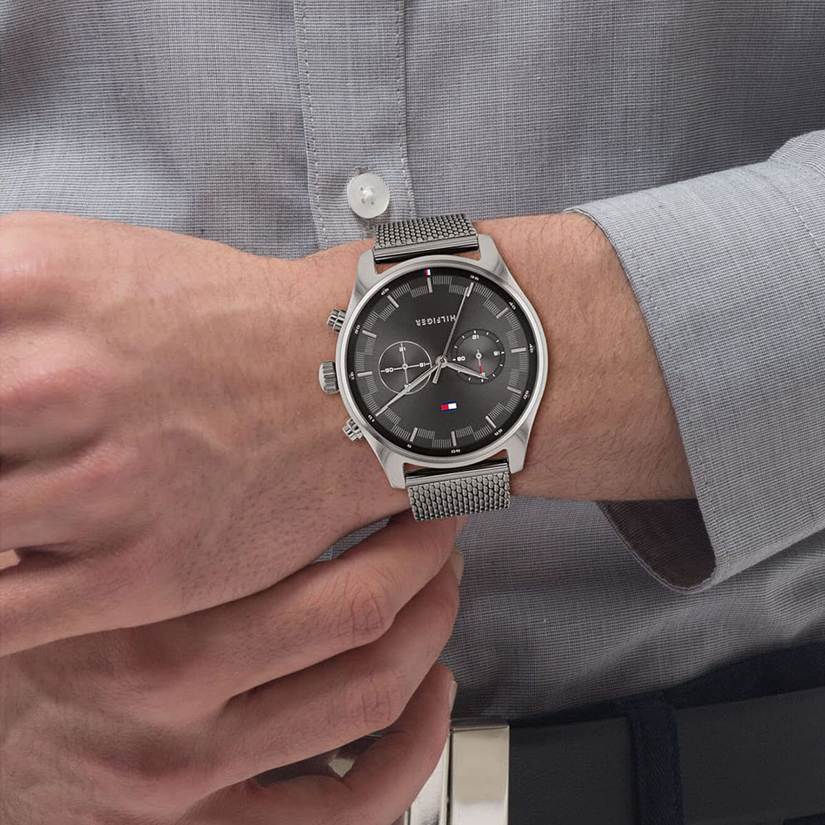 Tommy Hilfiger Sawyer watch worn on wrist with grey mesh strap
