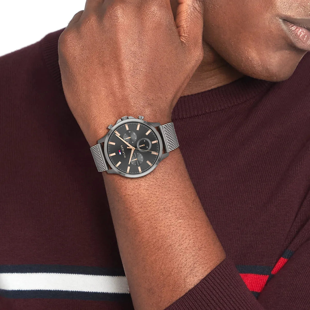 Tommy Hilfiger Ryder watch styled on wrist showing gunmetal dial and stainless steel mesh band