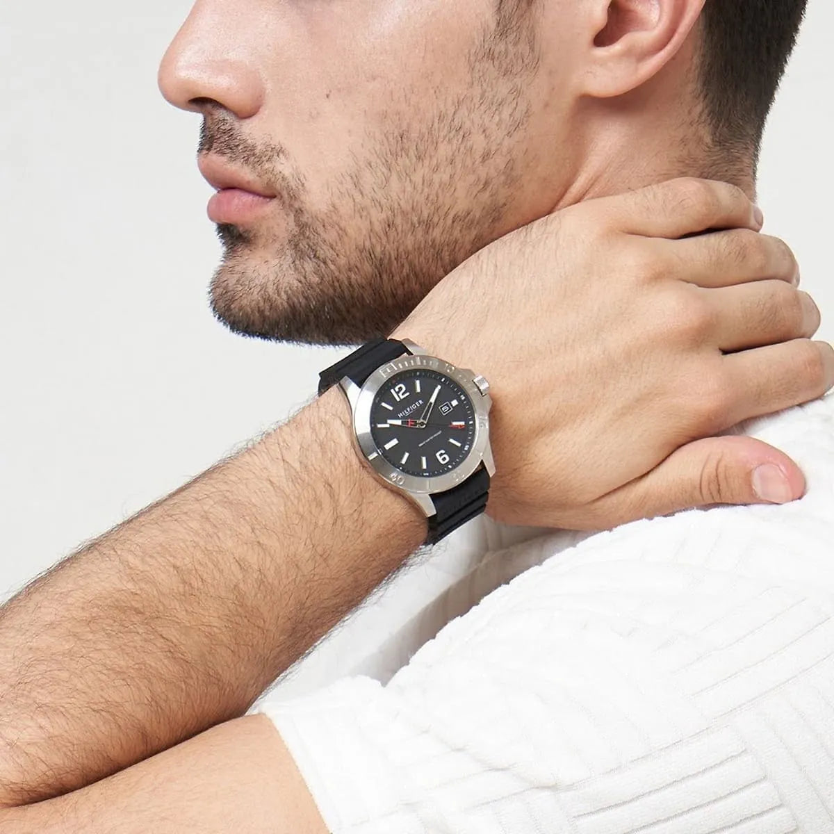 Tommy Hilfiger Ryan watch worn on man's wrist, side profile view