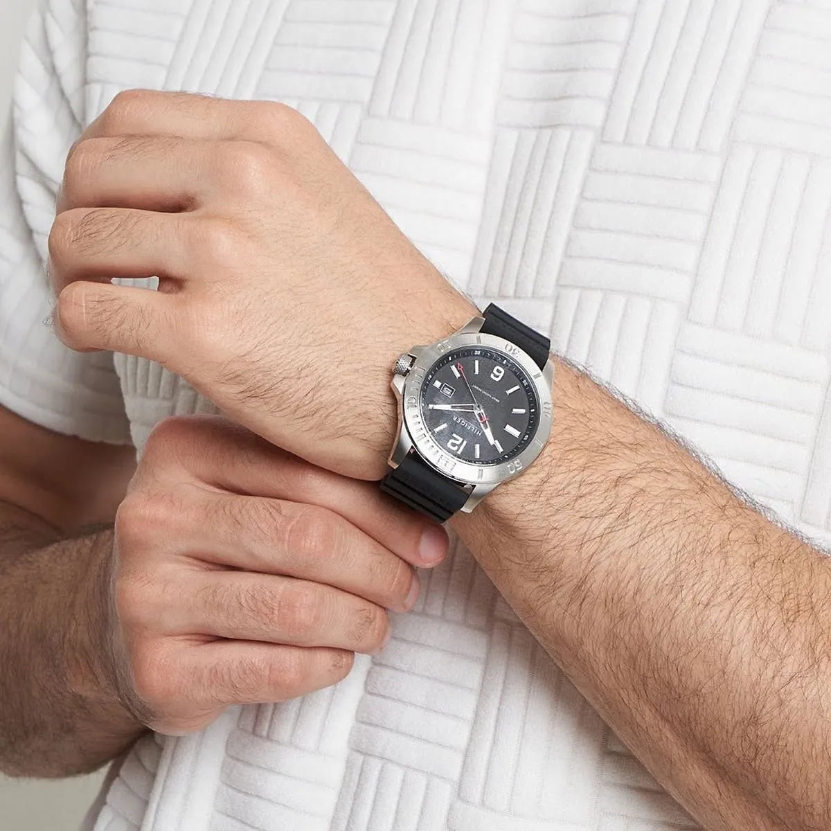 Tommy Hilfiger Ryan watch worn on man's wrist showing full dial and black strap