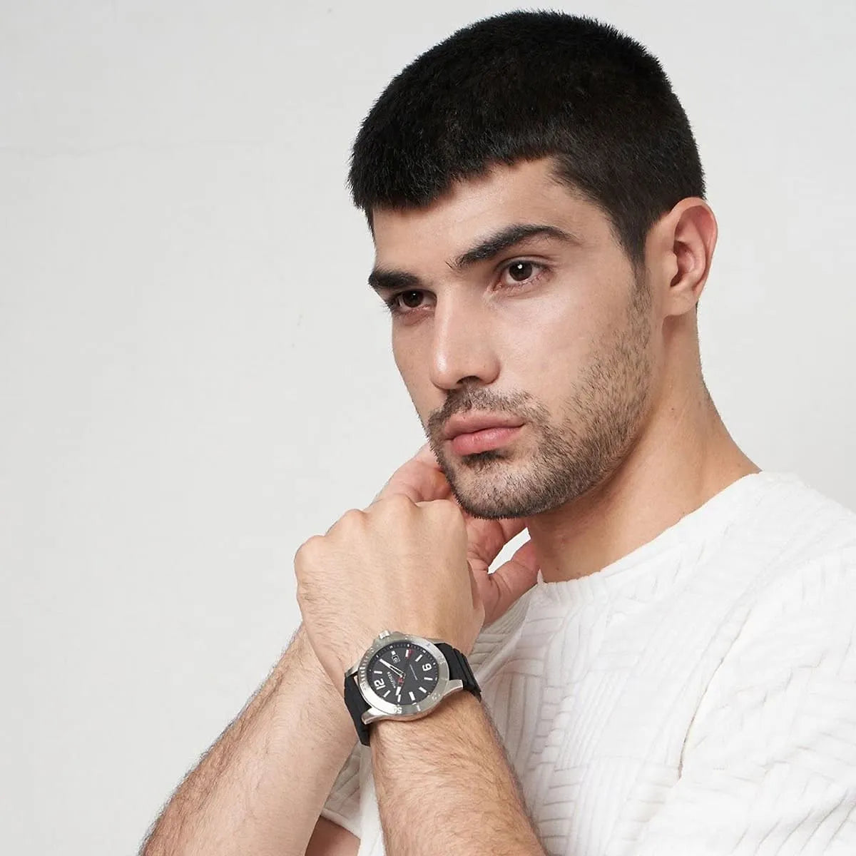 Tommy Hilfiger Ryan watch on wrist lifestyle shot showing watch worn by man