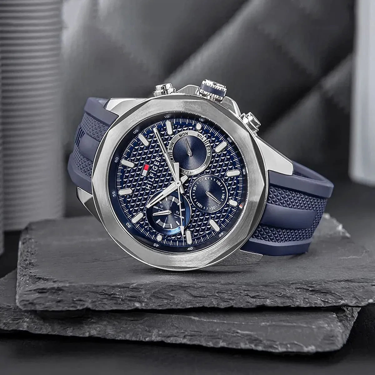 Tommy Hilfiger Lars watch three-quarter view showcasing silver case and navy strap