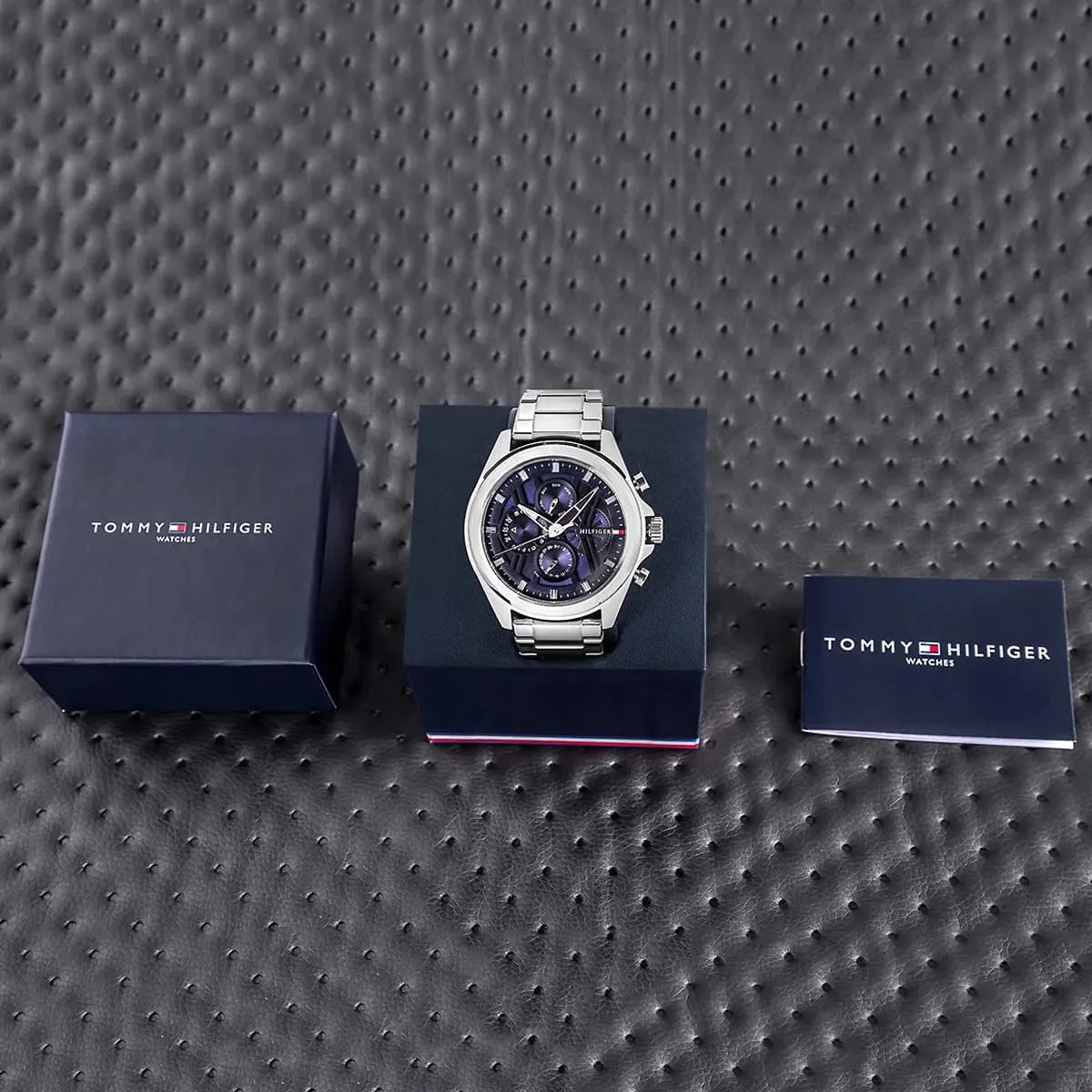 Tommy Hilfiger stainless steel chronograph watch bracelet links detail with reflection