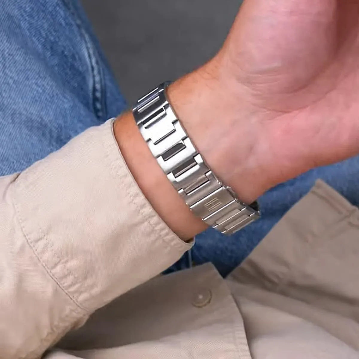 Tommy Hilfiger Henry watch on wrist showing stainless steel bracelet and navy chronograph dial