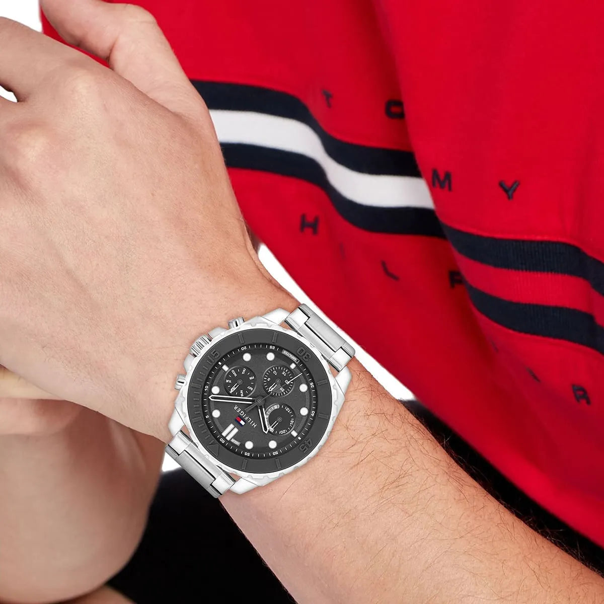 Tommy Hilfiger chronograph watch worn on wrist with dark grey dial