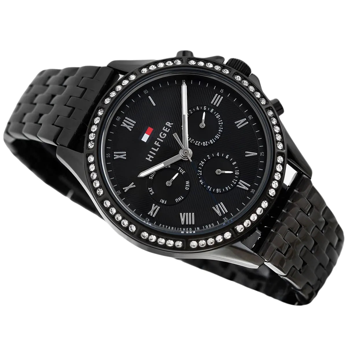 Tommy Hilfiger Ari watch shown from side angle with black strap and crystal-adorned bezel