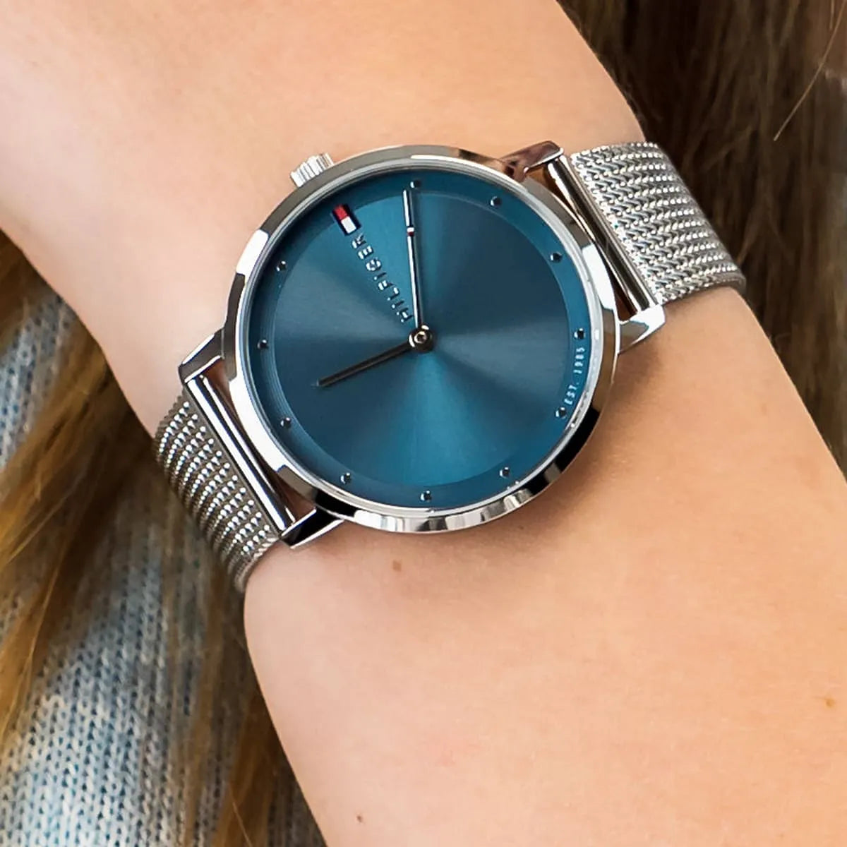 Tommy Hilfiger Pippa women's watch worn on wrist with blue dial and mesh band