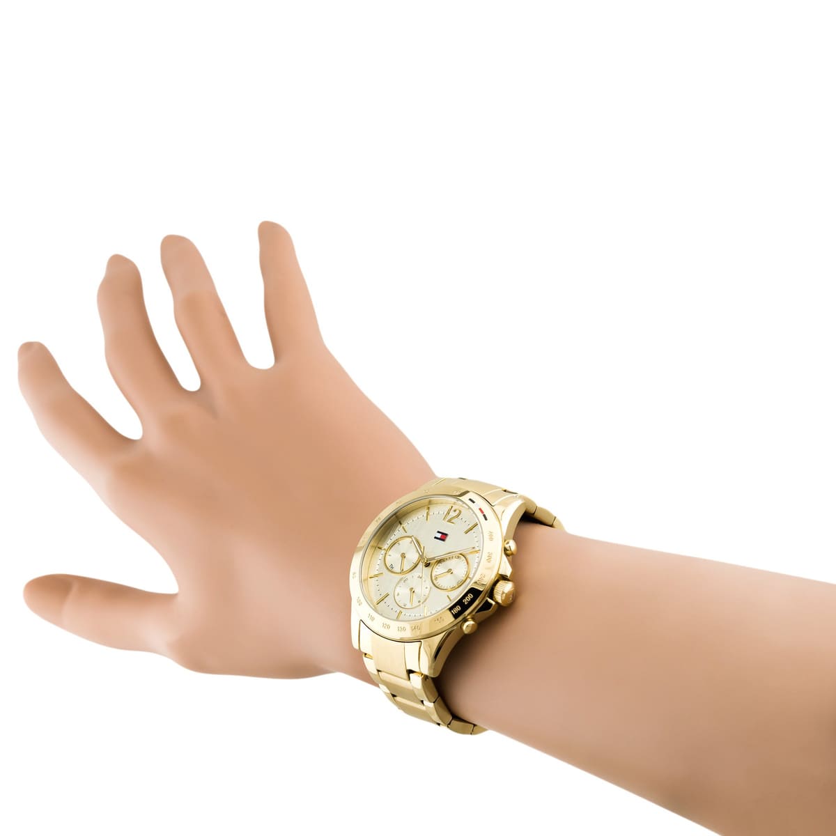 Tommy Hilfiger gold women's watch worn on wrist showing chronograph dial and bracelet