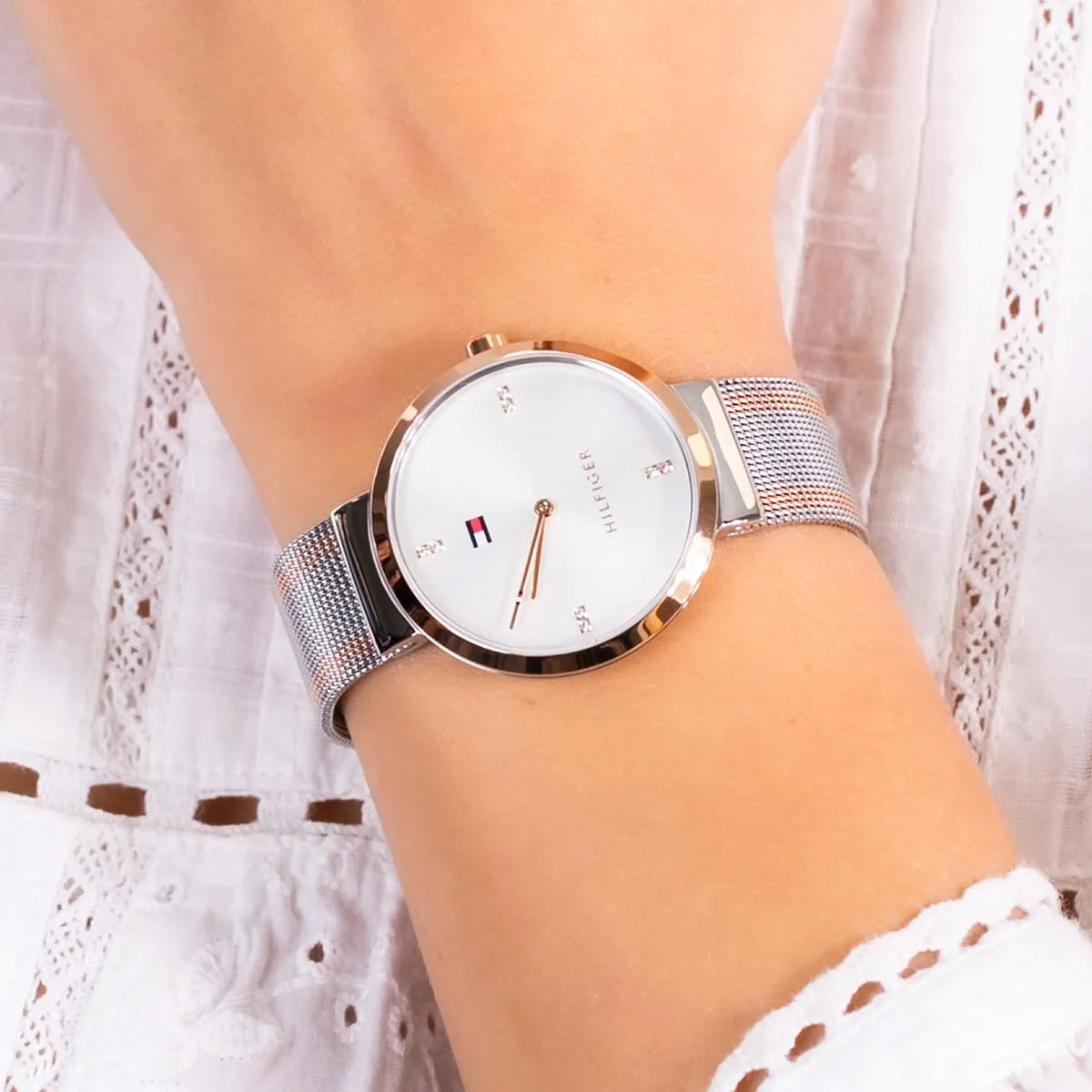 Tommy Hilfiger Liberty watch styled on wrist with white sleeve background