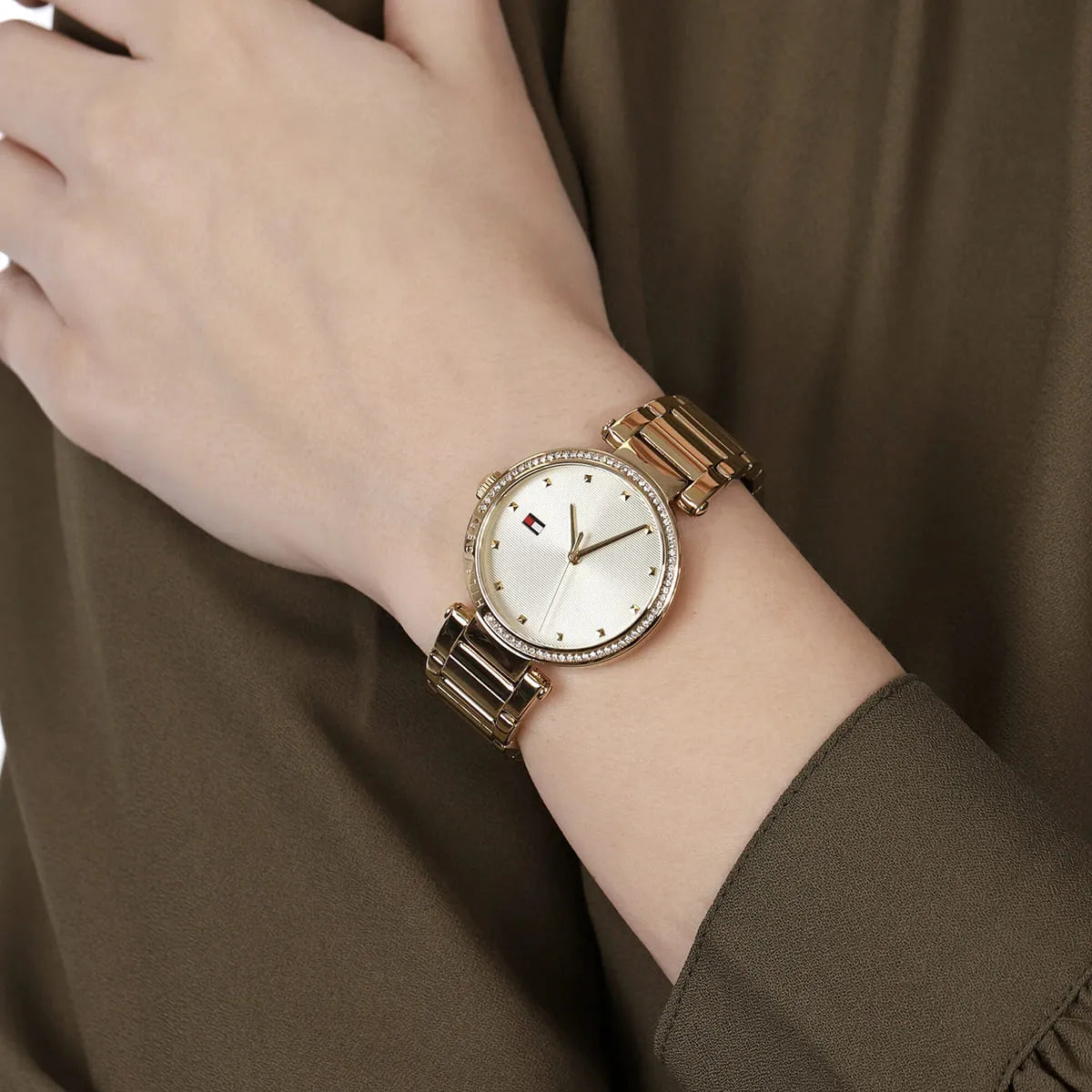 Tommy Hilfiger Lynn gold watch on wrist detail shot