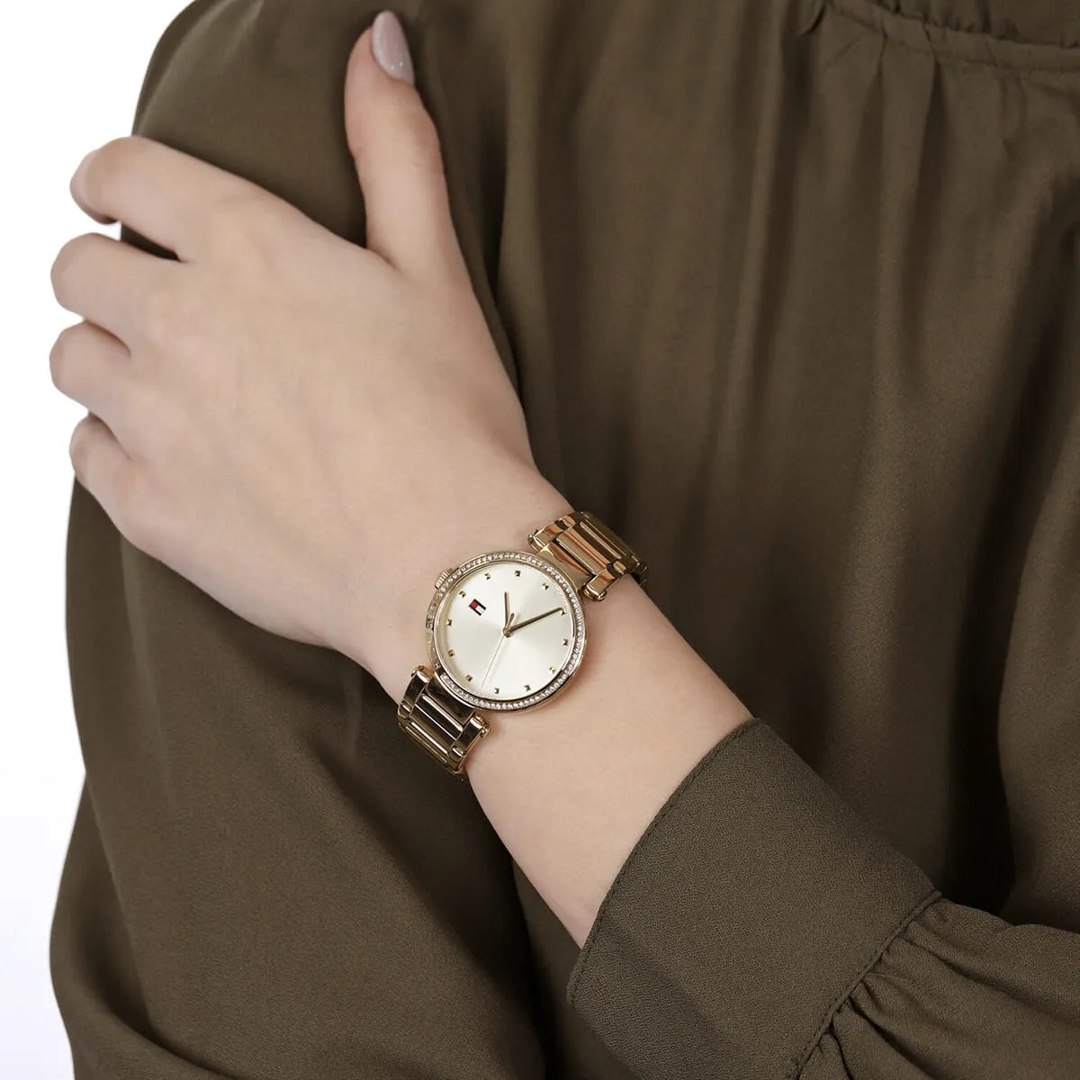 Tommy Hilfiger Lynn gold watch worn on wrist lifestyle image