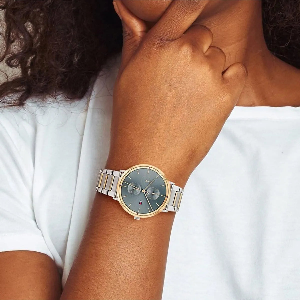Tommy Hilfiger Jenna women's watch on wrist with blue dial and mixed metal band