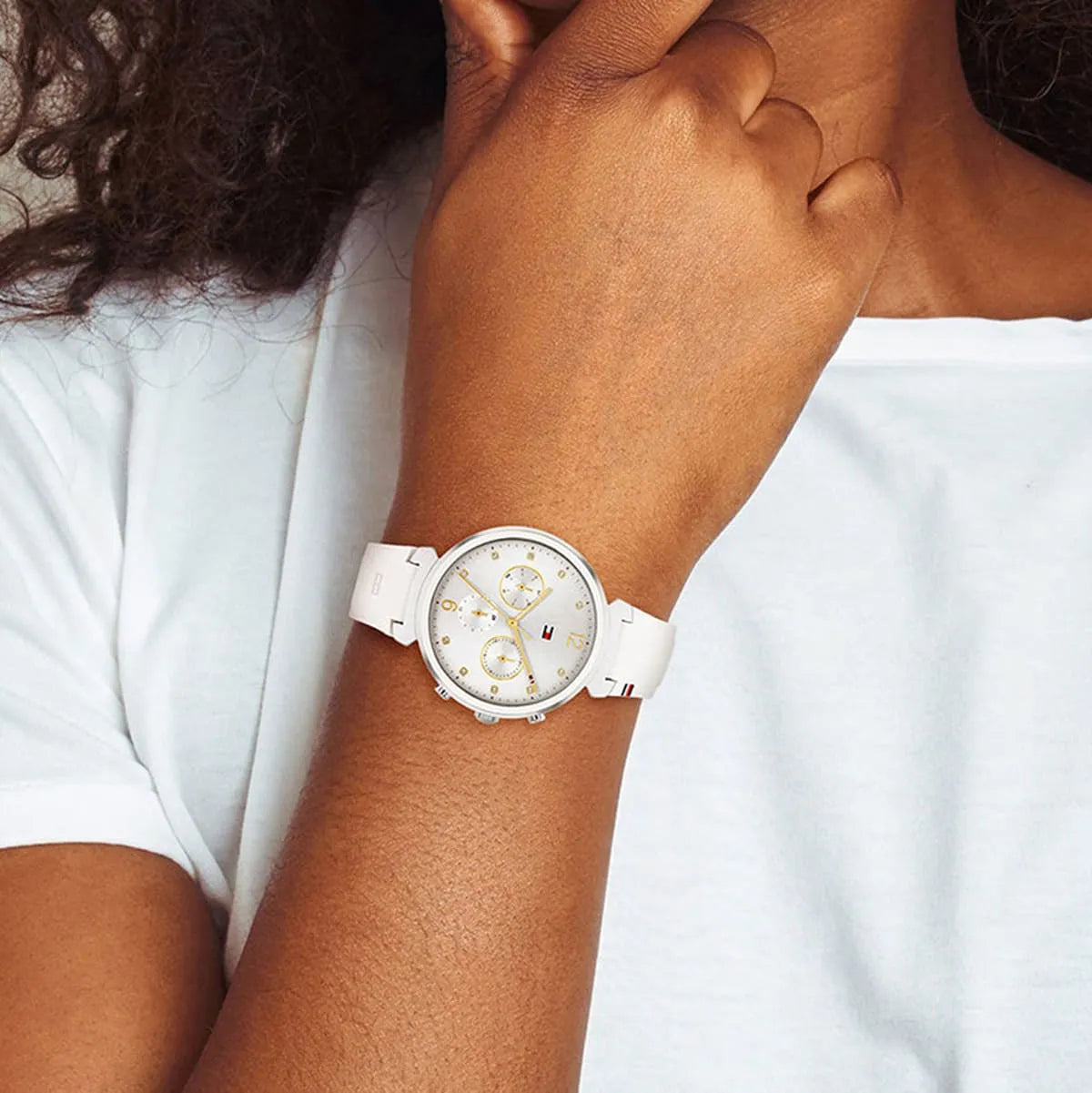 Tommy Hilfiger Ivy silver dial watch worn on wrist with white rubber strap
